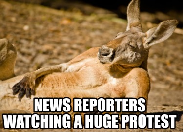 news-reporters-watching-a-huge-protest