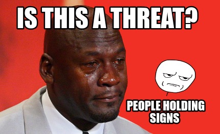is-this-a-threat-people-holding-signs
